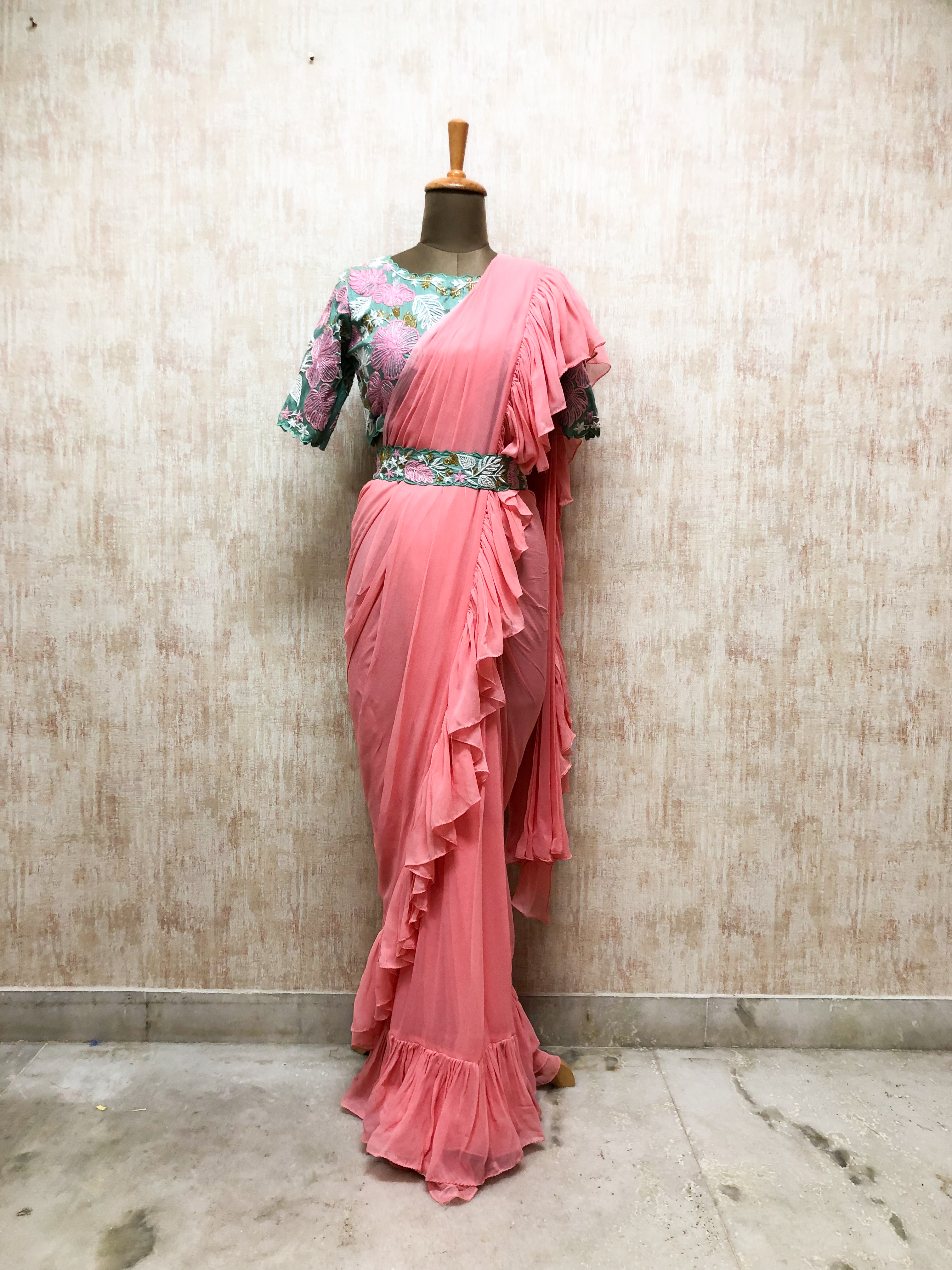 Pastel Pink Ruffle Saree with Embroidered Floral Blouse